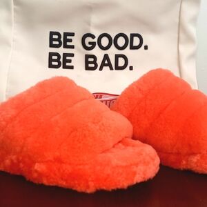 Plush Fuzzy Orange Slippers with 'Be Good. Be Bad.' Accent
